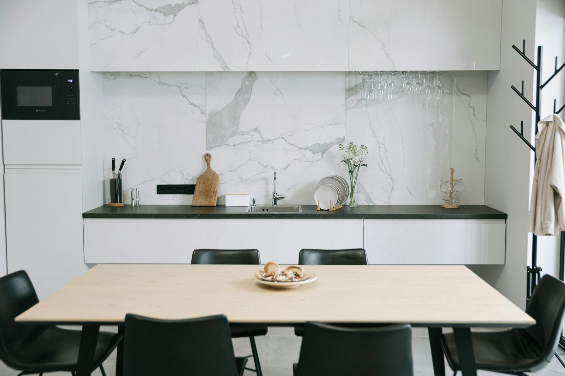 Kitchen and dining area with practical household pieces